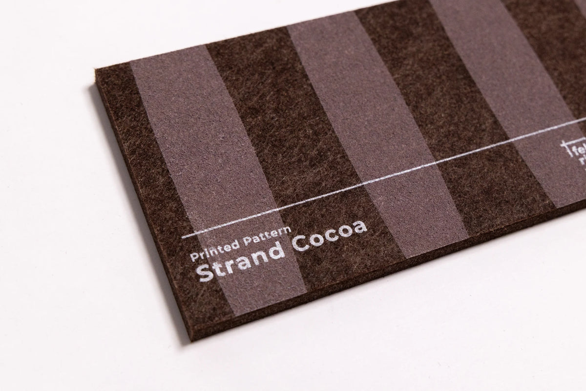 Close up of a sample for a brown felt wall panel