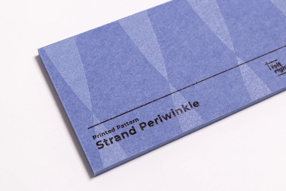 Close up of a blue felt sample for wall panels