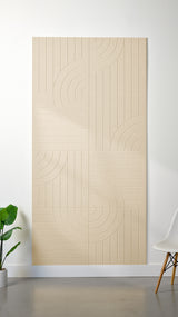 Beige Felt Right 4’ x 8’ PET felt panel with straight and circular lines engraved into the material against a white wall. A plant and chair are in the foreground.