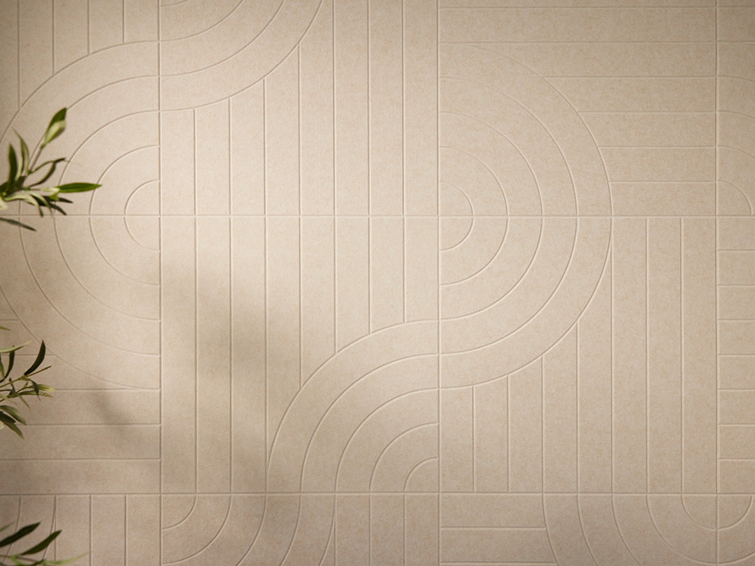 Beige tiles with circular patterns on a wall