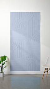 Light blue felt sheet with engraved geometric pattern of vertical lines and curved wave motifs arranged in sections.