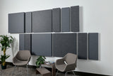 Grey acoustic wall panels on wall above chair