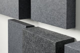 Gray acoustic blocks arranged in a geometric pattern on a white background