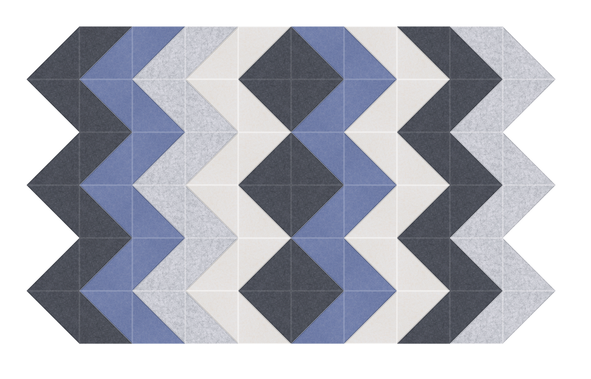 Geometric pattern with dark gray, blue, light gray, and cream colored triangles and diamonds arranged in repeating chevron de