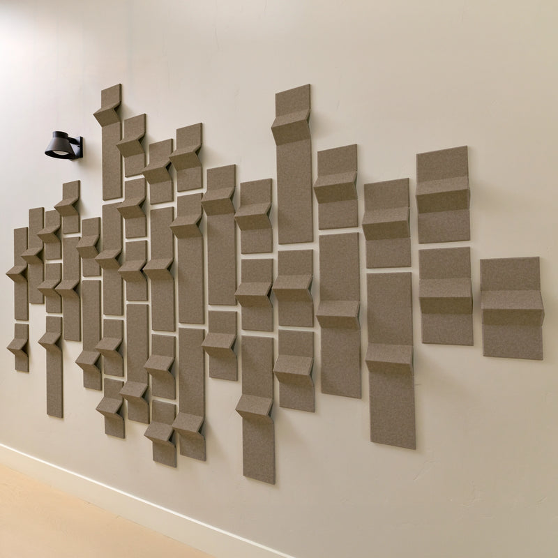 Brown felt acoustic tiles with peaks of dimension in a hallway