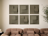 Six sage green tiles with dimensional geometric cutouts and raised elements arranged in a 2x3 grid on wall.