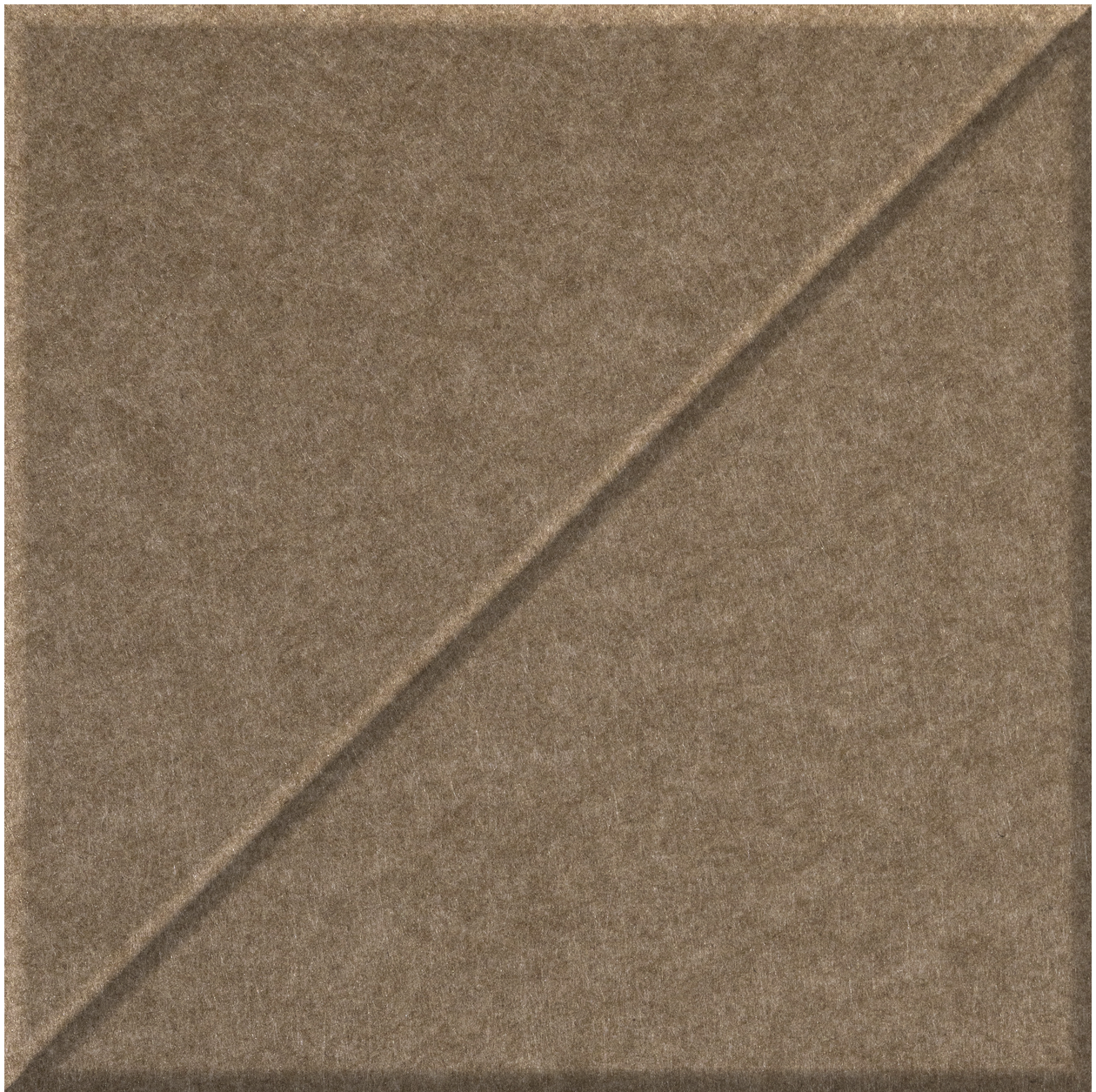 Tan ceramic tile with diagonal raised ridge running from upper right to lower left.