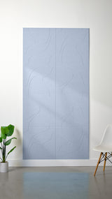Light blue felt sheet with engraved topographic contour line pattern in grid sections.