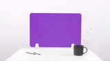 A lavender desk divider made of felt, displayed in a office setting with a desk and a coffee cup.