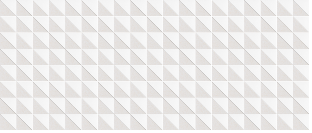 White textured wall surface with repeating diagonal geometric pyramid pattern.