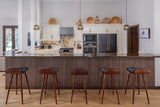 Walnut wood slatted wainscoting under kitchen bar with stools.