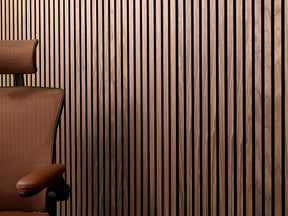 Walnut wood acoustic panel with desk chair