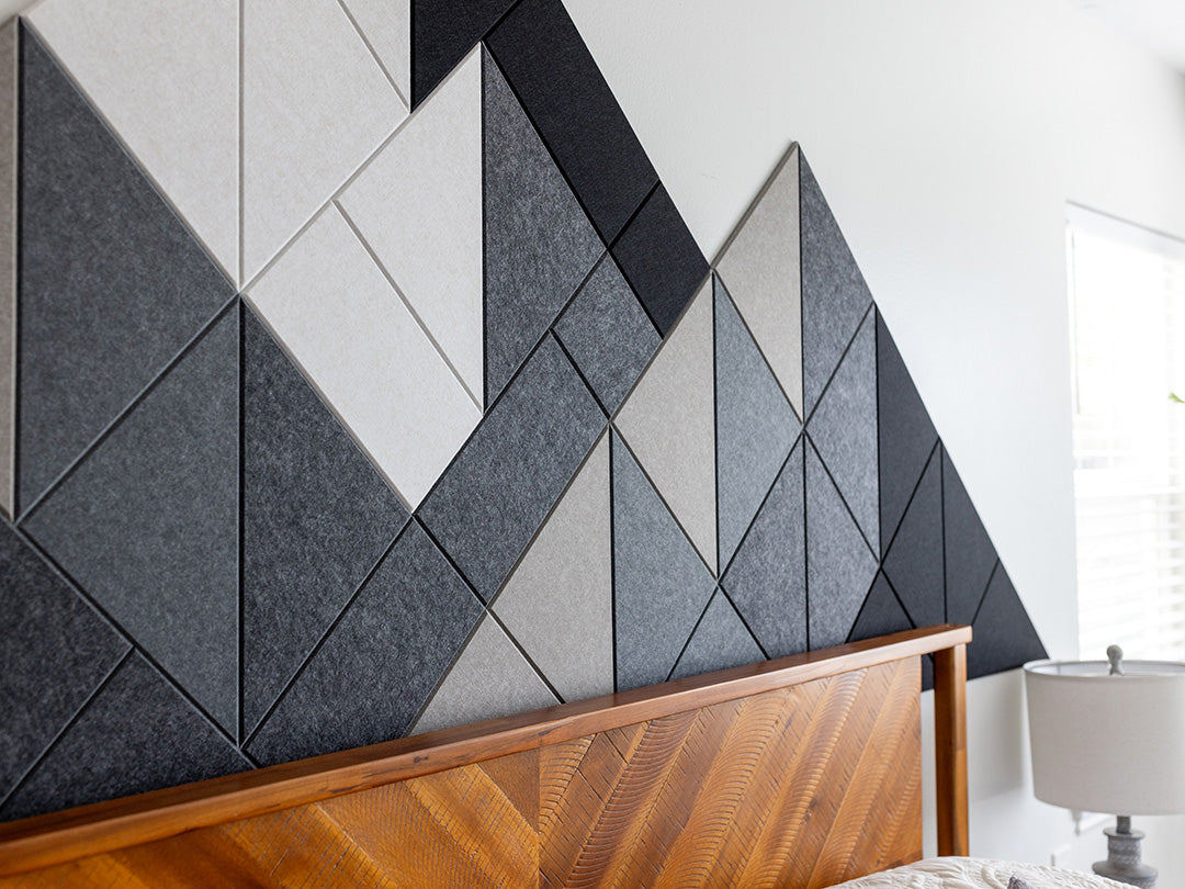 Warm Shaded Mountain Felt Right design above a wooden headboard and bed