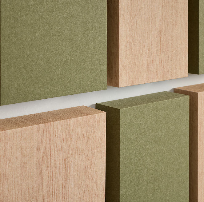 close zoom in shot of felt and wood grain 3D acoustic boxes
