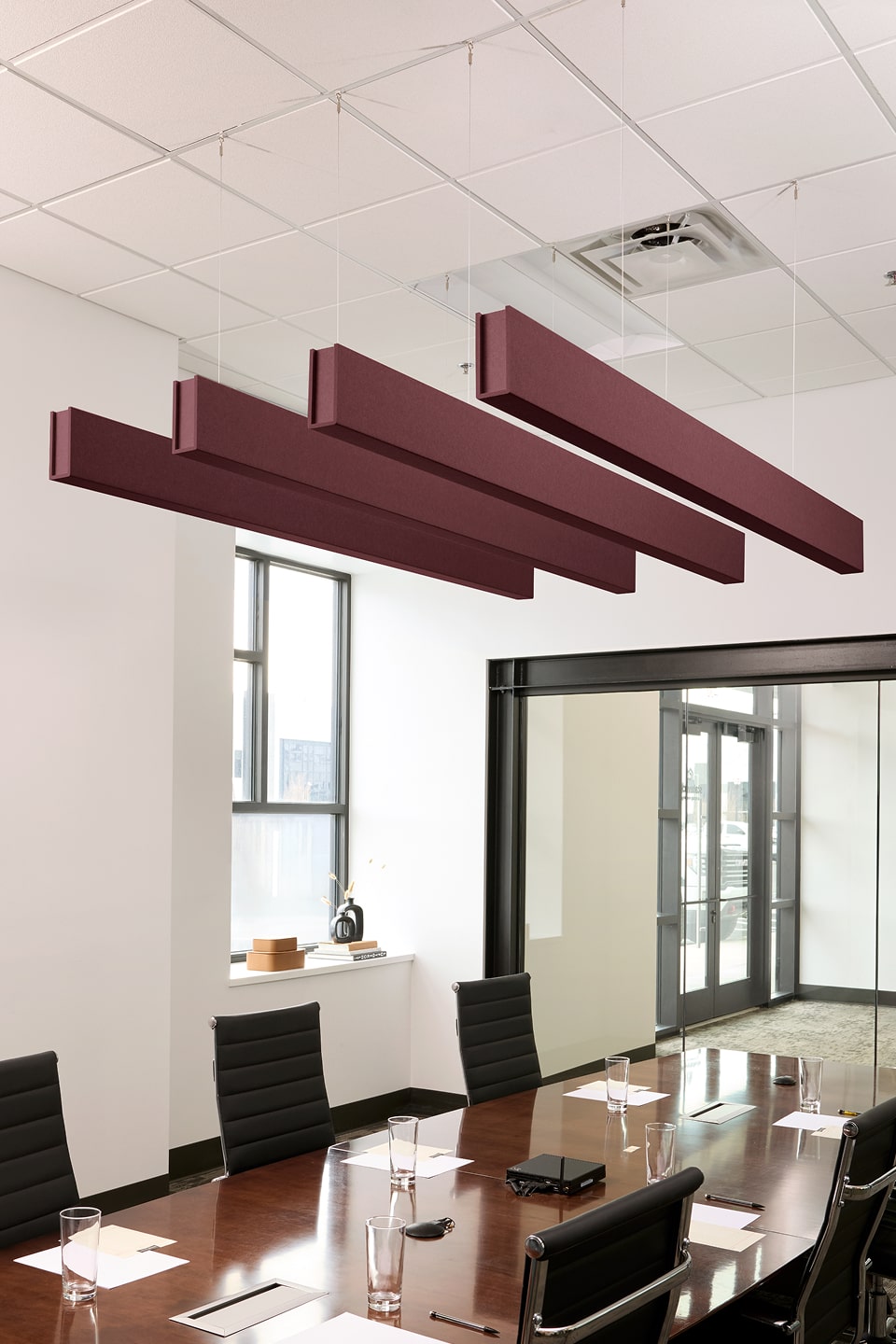 PET felt suspended acoustic beam in Wine by Felt Right absorbs unwanted noise and looks great in any setting. Available in four or eight foot lengths. Clips into ACT grid or drills into drywall ceiling.