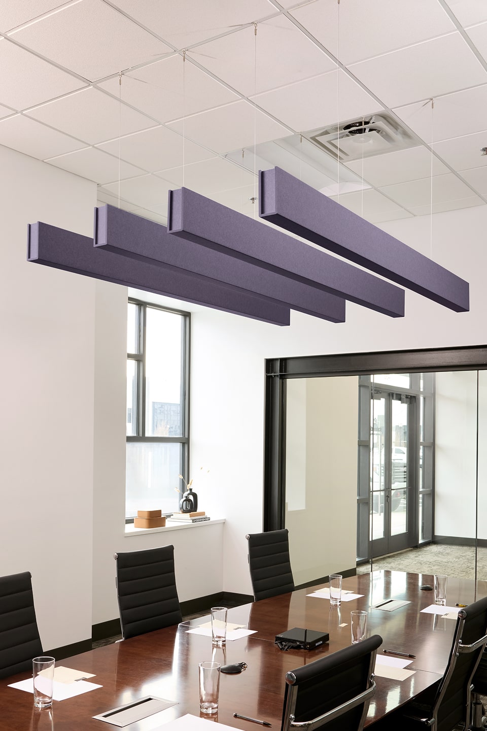 PET felt suspended acoustic beam in Wisteria by Felt Right absorbs unwanted noise and looks great in any setting. Available in four or eight foot lengths. Clips into ACT grid or drills into drywall ceiling.
