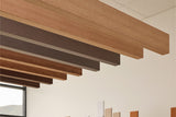 Felt acoustic wood grain ceiling beams in a modern interior setting
