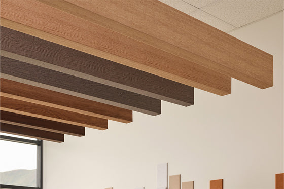 Felt acoustic wood grain ceiling beams in a modern interior setting
