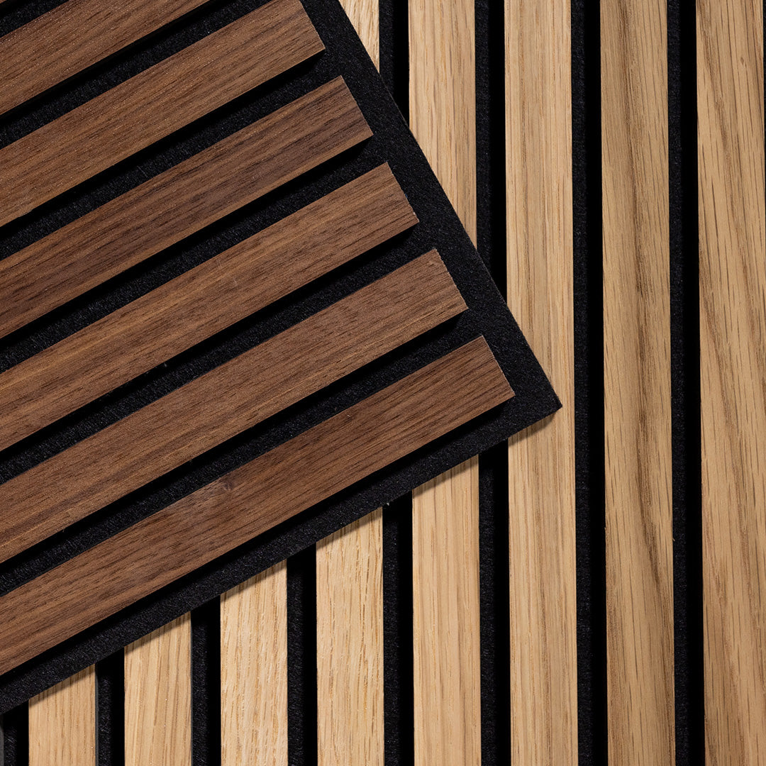 Felt Right Oak and Walnut Wood Slat Ceiling Tiles laid on top of each other. Walnut is on top.