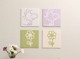 4 pastel panels with Woodstock illustrations on the wall.