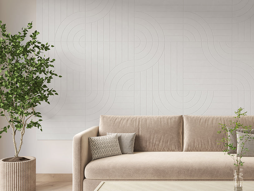Felt Right Tangent design on a Wall covered in Felt engraved tiles in the color zinc or white displayed in a living room behind a couch