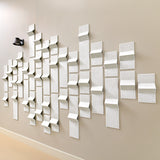 White acoustic felt tiles with peaks of dimension along a hallway wall with a light