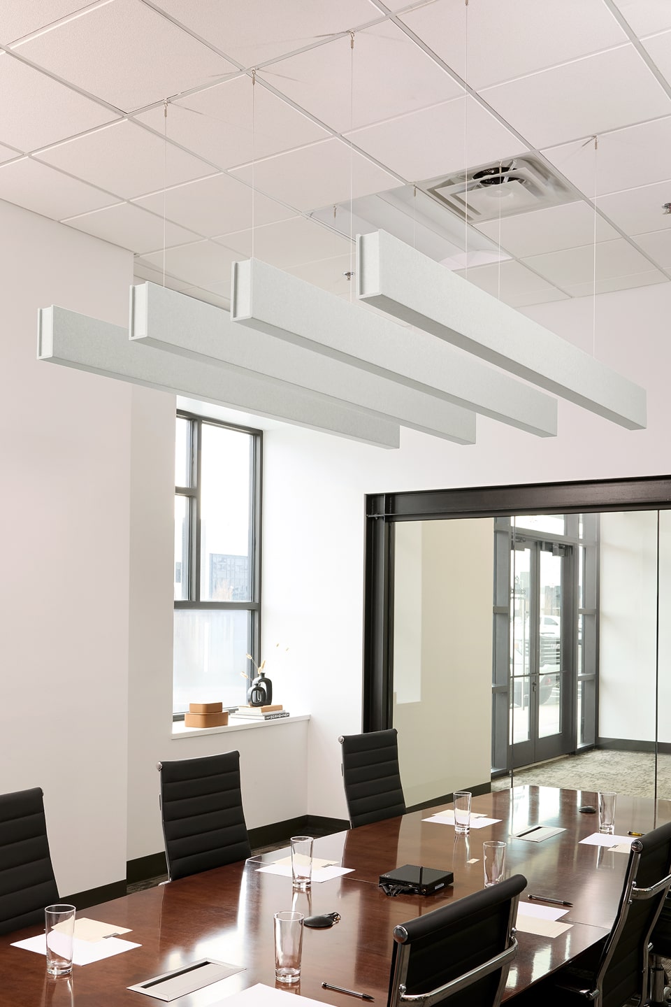 PET felt suspended acoustic beam in Zinc by Felt Right absorbs unwanted noise and looks great in any setting. Available in four or eight foot lengths. Clips into ACT grid or drills into drywall ceiling.