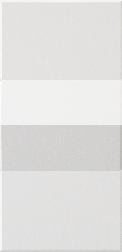 Four rectangular tiles in varying shades of white and gray stacked vertically.