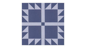 Felt Right Bears Paw quilt design wall in grey and blue displayed in a bedroom or craft room
