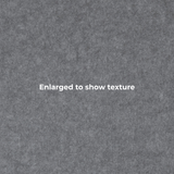 A close-up textured gray surface with the centered text 'Enlarged to show texture' in white.