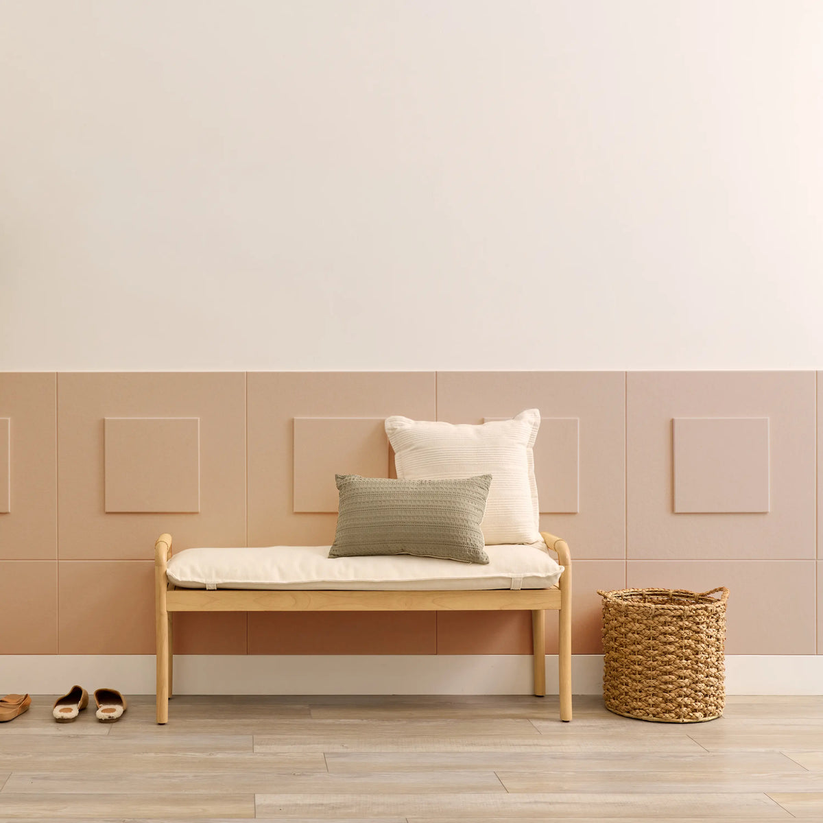 Terracotta square felt tiles layered over wainscoting behind an entryway bench