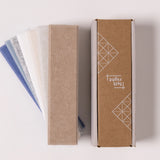 Neutral felt swatches in a sample box