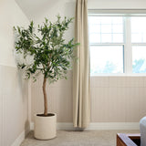 Ivory parallel felt wainscoting in a living room beside a potted plant