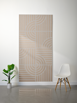 Tan felt sheet with engraved geometric pattern of curved and straight lines arranged in four quadrants.