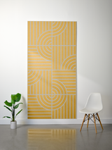 Gold and tan felt sheet with engraved geometric line and arc pattern in four quadrants.