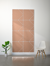 Tan and white layered felt sheet with engraved geometric chevron and diagonal stripe pattern forming symmetrical sections.