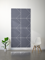 Dark blue felt sheet with white engraved geometric chevron and diagonal line pattern arranged in four quadrants.