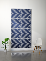 Navy blue felt sheet with white engraved geometric chevron and diagonal line pattern in four quadrants.