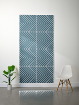 Teal felt sheet with layered geometric chevron and diagonal line engraved pattern in four quadrants.