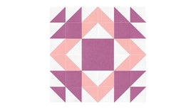 Felt Right Mothers Favorite quilt design wall in light pink and purple displayed in a bedroom or craft room