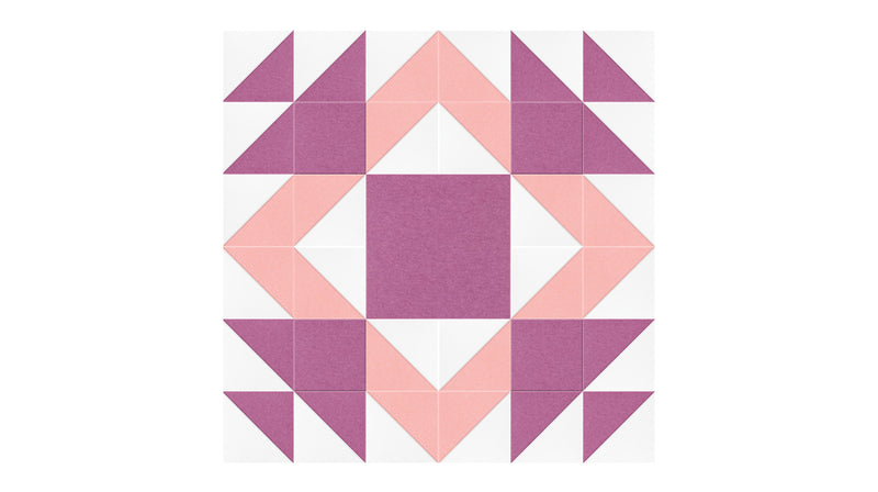 Felt Right Mothers Favorite quilt design wall in light pink and purple displayed in a bedroom or craft room