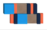 3D geometric design with stacked rectangular blocks in blue, coral, navy, and taupe colors.