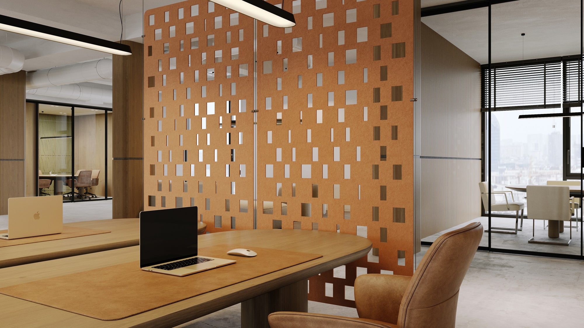 Orange earth toned geometric acoustic panels in a open office space
