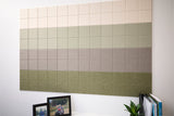 Wall art panel featuring gradient tiles transitioning from cream to light green to taupe to sage green.