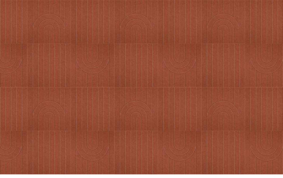 Terracotta tile flooring with vertical grout lines and repeating arch motif pattern.