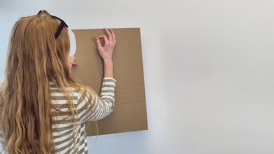 Video showing installation of world map wall art