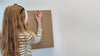 Video showing installation of world map wall art