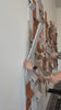 Women installing dimensional wall panels