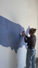 Women pinning pictures on a blue United States map 