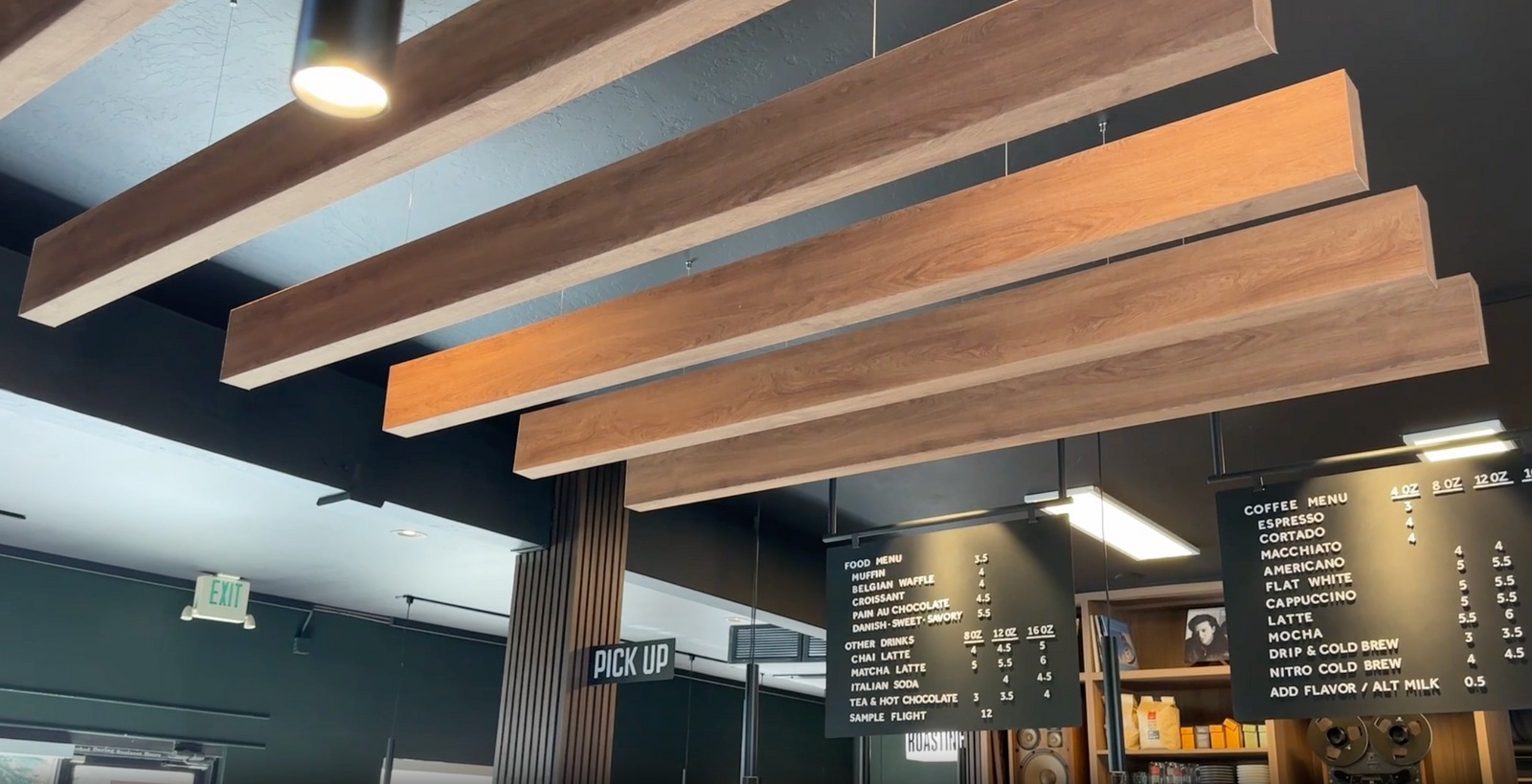 wood acoustic beams hanging in coffee shop.